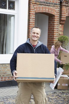 Removal team loading household belongings in Putney