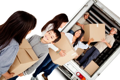 Furniture removal team loading items for a Putney home move