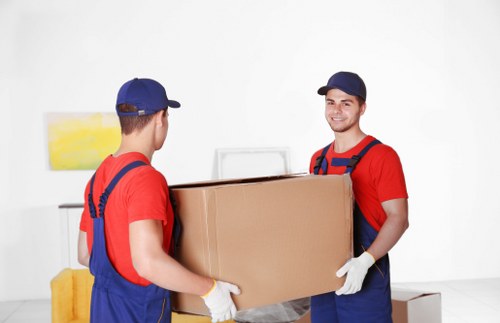 Prepared moving boxes and household items ready for collection in Putney