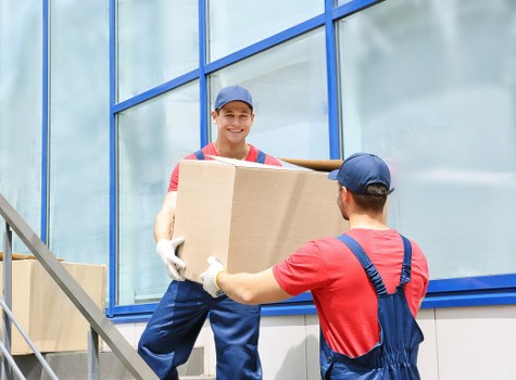 Local man with van loading items for a Putney move