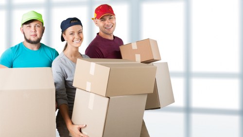 Local office movers handling equipment during a Putney relocation