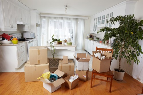 Moving van with reusable boxes and recycling containers in Putney