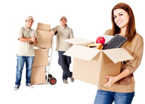 Local movers handling furniture in a Putney residential street