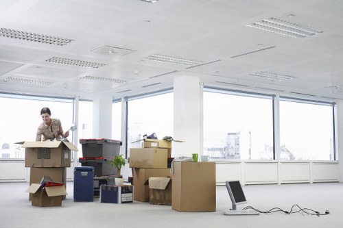 Professional packers organising household items for transport in Putney