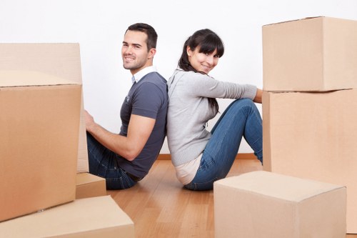 Removal crew loading office furniture with care for a Putney business move